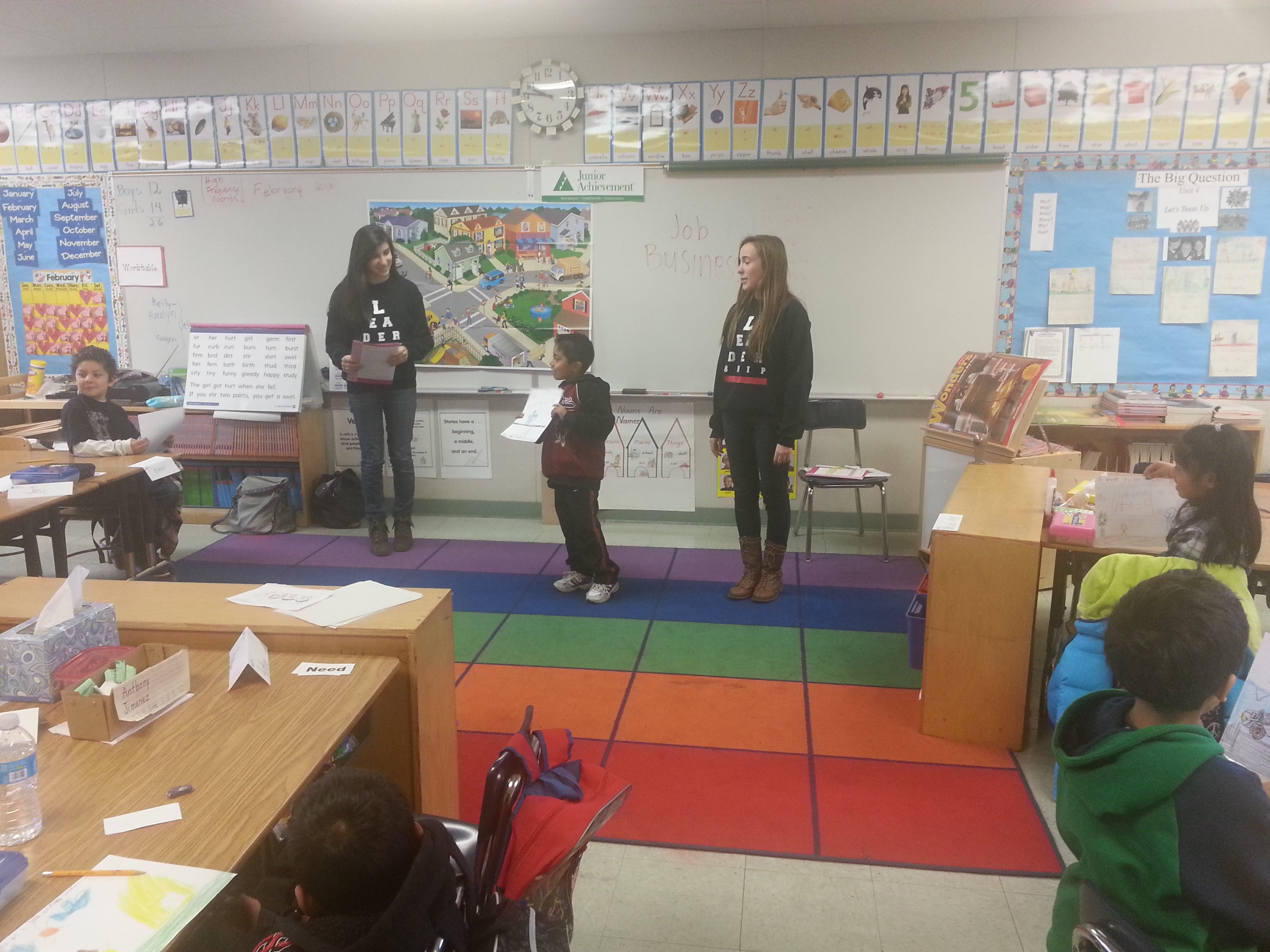 Elementary students present their culminating projects to their classmates. 