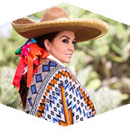Woman wearing Mexican clothing and hat.