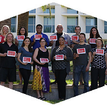 Faculty and staff hold up their CSUN Connects placards.
