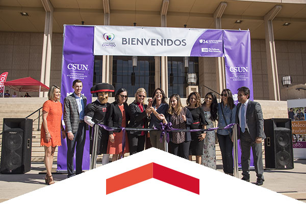 A group ribbon cutting to begin Feria de Educación.