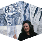 Judy Baca stands before her Great Wall of Los Angeles mural. 
