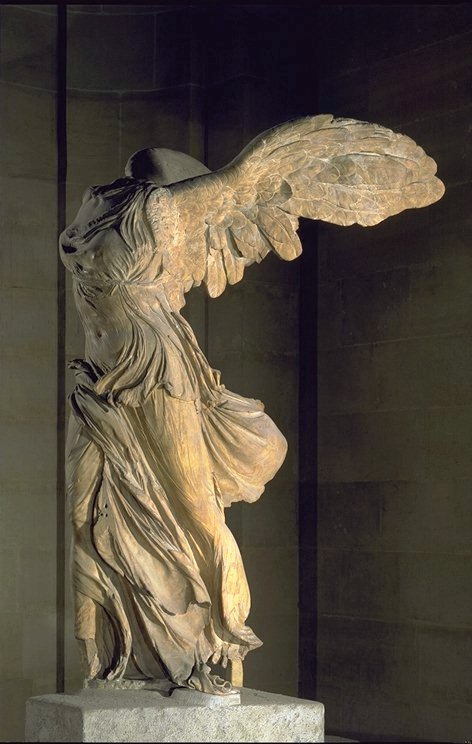 The Winged Victory of Samothrace, a headless statue in the Louvre Museum