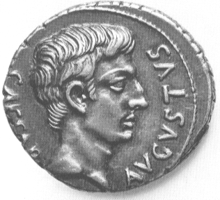 A silver Roman  denarius coin , showing  the head of  Augustus,with the legend CAESAR AUGUSTUS