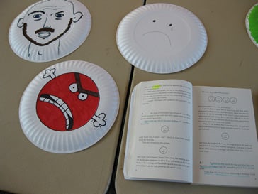 Various drawings made on the back of plastic plates