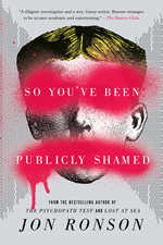 Book cover shows a face with red paint splashed across the eyes and mouth.