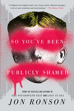 Book cover shows a face with red paint splashed across the eyes and mouth.