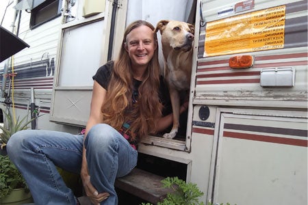 Blonde Female, Max Gladden, with her dog sitting