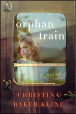 A wistful girl looks out through the window of a train's door.
