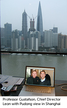 Photo of Professor Gustafson, Chief Director Leon on hotel desk with Pudong view in Shanghai