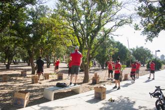 students harvesting oranges