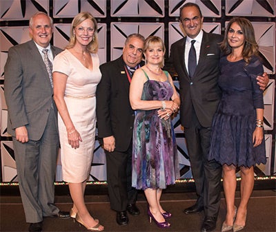 Photo of Kenneth R. Lord, Dianne F. Harrison, Harvey Bookstein, Harriet Bookstein, David Nazarian and Angella Nazarian at the business college's 50th anniversary celebration.
