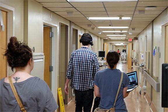 students use technology to study wayfinding design in a healthcare facility.