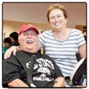 Photo of Donors Bob and Sue Janovici in CSUN’s Center of Achievement Through Adapted Physical Activity surrounded by exercise equipment.