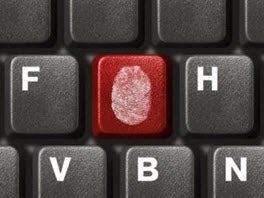 Keyboard with thumbprint on a key, representing Identity Theft. 