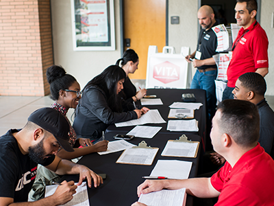 student volunteers assist taxpayers