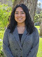 Marisol Lopez standing outdoors in front of a tree.