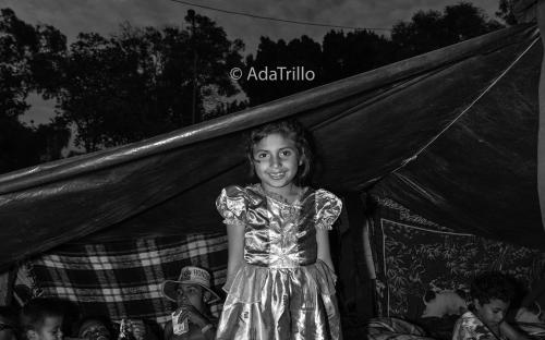 Diana, 8 years old, happily sports a dress that she was lucky to grab when donated clothing was being distributed at the Benito Juarez shelter in Tijuana Mexico.