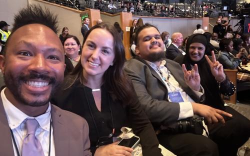 smiling CSUN students in auditorium