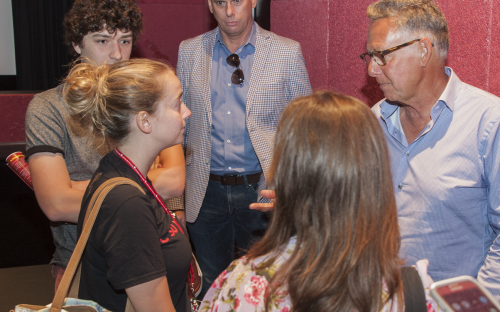 Michael Grillo talking to students after the panel discussion