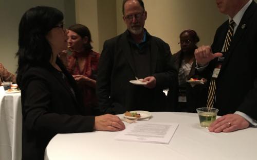 Dean Spagna &amp; Joyce Burstein talking around the table