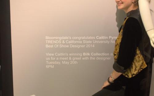 Caitlin Pynes stands at the entrance to the exhibit at Bloomingdale&#039;s.