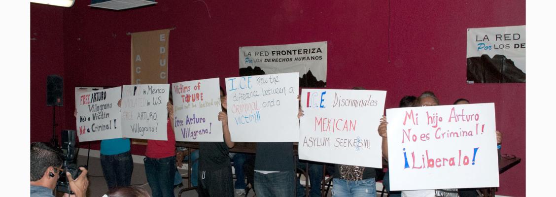 Mexicans in Exile holding signs