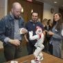 photo of audience member watching student-created robot at the 2018 AI Jam