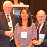 Sayuri Pacheco stands with her win at the Sigma Xi Student Conference