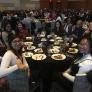 BUILD PODER students sitting at a table at ABRCMS conference
