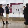 8th grade students give a poster presentation 