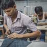 men work at sewing machines