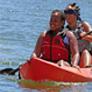 community members paddle a kayak on lake castaic