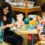 Students working with educational toys at a table