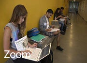 "Zoom" graphic; a student using a laptop. 