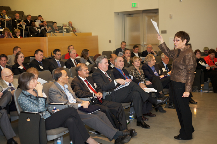 President Koester addressing assemble volunteer and University leadership at Summit.  Front row: Summit Co-Chair and former Hawai’i Governor Linda Lingle ’75, Professor C.T. Lin, Dean S. Ramesh, Dean Michael Spagna, Ford Roosevelt, Professor Shawna Dark, Professor Jon Stahl and Dean Bob Bucker.  Taken at the Inaugural Volunteer Leadership Summit. 