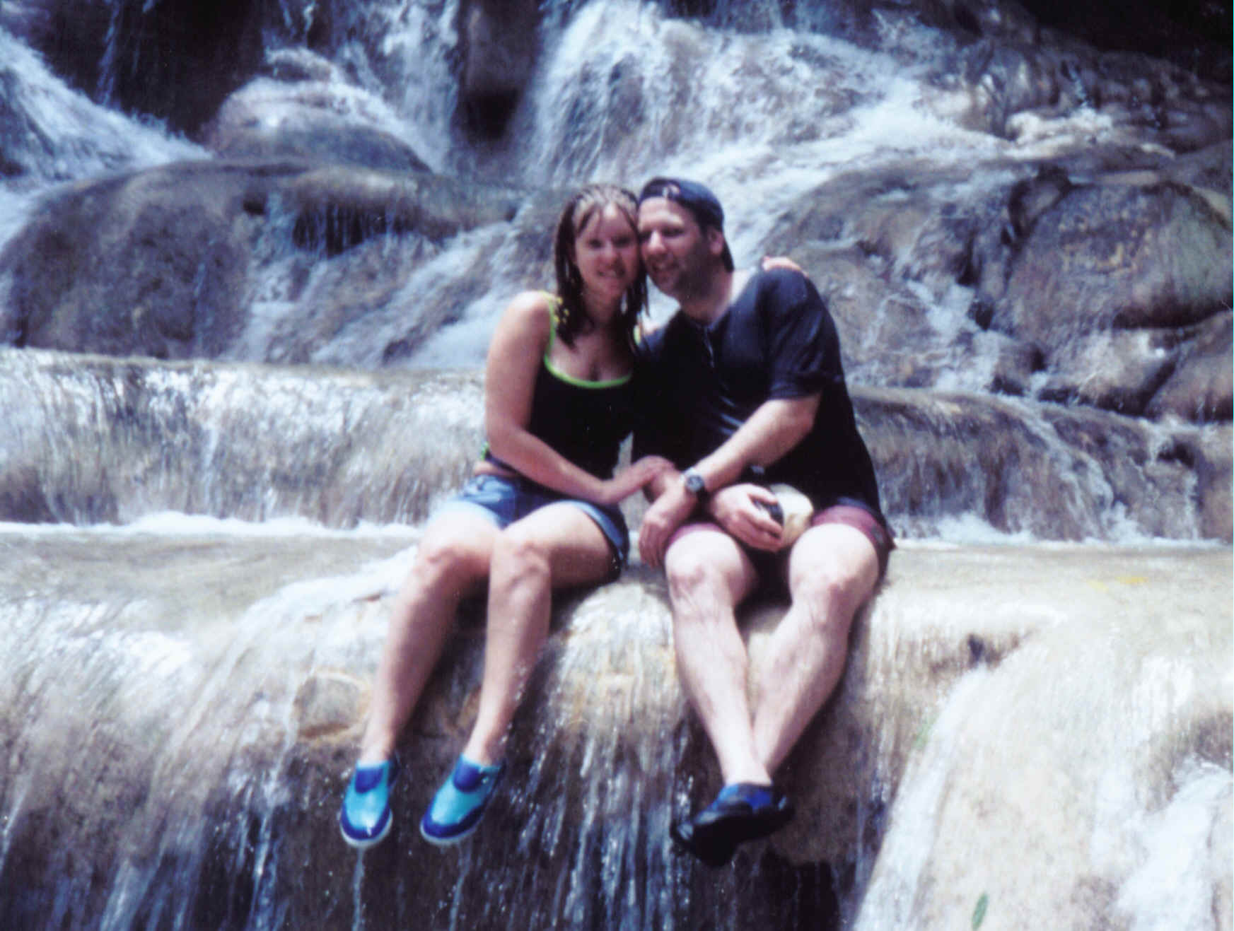 Picture: Me and Barak(my husband) sitting in the water of Dann's River Falls in Jamaica,the Caribbean Islands(AUG 2000)