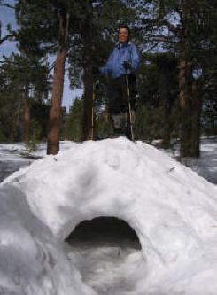 students on top of strong snowcave